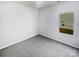 Cozy bedroom with neutral walls and a large window overlooking the neighborhood at 4122 Munson Dr, Charlotte, NC 28215