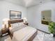 Inviting primary bedroom with modern furnishings, plush bedding, and ample natural light at 4122 Munson Dr, Charlotte, NC 28215