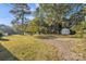 Spacious backyard featuring a large grassy area and a shed at 4315 Gibbon Rd, Charlotte, NC 28269