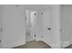 Hallway view to bathroom with decorative tile floor at 4315 Gibbon Rd, Charlotte, NC 28269