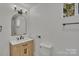 This bathroom features a modern vanity, a mirror, and contemporary fixtures at 4315 Gibbon Rd, Charlotte, NC 28269