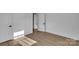 This is a bedroom featuring new flooring and fresh paint with a door to the hallway at 4315 Gibbon Rd, Charlotte, NC 28269