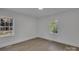 Bright bedroom featuring new flooring, fresh paint, and natural light from two windows at 4315 Gibbon Rd, Charlotte, NC 28269