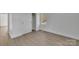 Well-lit bedroom with closet, showing fresh paint, luxury vinyl flooring, and natural light at 4315 Gibbon Rd, Charlotte, NC 28269