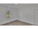 This bedroom is painted white and has luxury vinyl flooring with a view out the window at 4315 Gibbon Rd, Charlotte, NC 28269