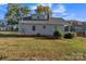 Charming home featuring a well-maintained lawn and traditional architectural details at 4315 Gibbon Rd, Charlotte, NC 28269
