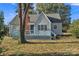 Charming single-story home featuring a cozy front porch, brick chimney, and inviting curb appeal at 4315 Gibbon Rd, Charlotte, NC 28269