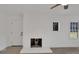Painted brick fireplace and wood-look floors create a welcoming living space at 4315 Gibbon Rd, Charlotte, NC 28269