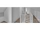 Hallway with view of staircase and luxury vinyl flooring with white paint at 4315 Gibbon Rd, Charlotte, NC 28269