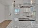 Modern kitchen featuring stainless steel appliances, granite countertops, and stylish lighting at 4315 Gibbon Rd, Charlotte, NC 28269