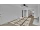 Open-concept living room with stairs, fireplace, and abundant natural light at 4315 Gibbon Rd, Charlotte, NC 28269