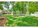 Expansive backyard with lush greenery and lake views, perfect for outdoor relaxation and recreation at 4681 Dove Point Ln, York, SC 29745