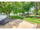 Lush backyard with mature trees, leading to the lake; perfect for outdoor enjoyment at 4681 Dove Point Ln, York, SC 29745