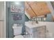 Rustic bathroom with wood ceiling, white vanity and toilet, and charming nautical decor at 4681 Dove Point Ln, York, SC 29745