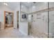 Contemporary bathroom offers a tile shower with a glass enclosure and a pebble floor at 4681 Dove Point Ln, York, SC 29745