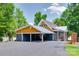 View of the exterior featuring a covered parking area and a glimpse of the tranquil waterfront at 4681 Dove Point Ln, York, SC 29745