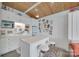 Charming kitchenette with white cabinets, an island, and a retro-style refrigerator at 4681 Dove Point Ln, York, SC 29745
