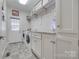 Functional laundry room features modern washer and dryer appliances and ample storage at 4681 Dove Point Ln, York, SC 29745