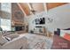 Inviting living room with brick fireplace, vaulted ceilings, wood beams and stylish decor at 4681 Dove Point Ln, York, SC 29745
