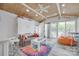 Versatile room showcasing a sofa bed, and sliding doors leading to outdoor views at 4681 Dove Point Ln, York, SC 29745