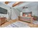 Bright bedroom features exposed beams, hardwood floors, and an ensuite bathroom at 4681 Dove Point Ln, York, SC 29745
