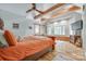 Spacious bedroom boasts exposed beams, a ceiling fan, and plenty of natural light at 4681 Dove Point Ln, York, SC 29745
