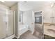 Bathroom featuring a walk-in shower and a separate tub by a window at 5002 Abode Lily Ln, Charlotte, NC 28227