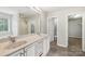 Bathroom with double sinks, spacious mirror, and a separate toilet room at 5002 Abode Lily Ln, Charlotte, NC 28227