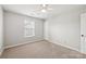 Bedroom with carpet, one window, and a ceiling fan at 5002 Abode Lily Ln, Charlotte, NC 28227