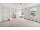 Neutral bedroom with carpet, a ceiling fan, and two windows at 5002 Abode Lily Ln, Charlotte, NC 28227