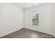 Cozy bedroom with neutral decor, window views, and ample natural light at 5002 Abode Lily Ln, Charlotte, NC 28227