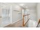 Upstairs hallway features white railing and shelf at 5002 Abode Lily Ln, Charlotte, NC 28227