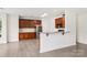 Beautiful kitchen features stainless steel refrigerator, wood cabinets and granite countertops at 5002 Abode Lily Ln, Charlotte, NC 28227
