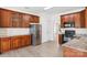 Charming kitchen with ample cabinets, stainless steel refrigerator, and modern appliances at 5002 Abode Lily Ln, Charlotte, NC 28227
