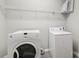 Laundry room featuring a washer, dryer, and storage space at 5002 Abode Lily Ln, Charlotte, NC 28227
