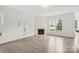 Spacious living room features fireplace, large window, and open layout at 5002 Abode Lily Ln, Charlotte, NC 28227