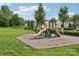 Community playground with a slide and climbing equipment set in a grassy area, ideal for outdoor fun at 5002 Abode Lily Ln, Charlotte, NC 28227