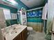 Bathroom featuring a vanity, toilet, and shower with a tropical-themed shower curtain at 501 N Johnson St, Monroe, NC 28112