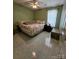 The bedroom features tile floors, a comfortable bed, and natural light at 501 N Johnson St, Monroe, NC 28112