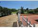 View of the brick driveway leading to the yard with a white picket fence to add charm at 501 N Johnson St, Monroe, NC 28112