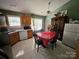 Bright eat-in kitchen area featuring classic cabinets, and tile flooring at 501 N Johnson St, Monroe, NC 28112