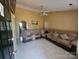 Cozy living room featuring comfortable seating, tile floors, and neutral walls at 501 N Johnson St, Monroe, NC 28112