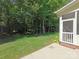 Lush backyard space with mature trees creating a private outdoor retreat at 509 Settlers Grove Ln, Salisbury, NC 28146