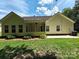 Expansive backyard featuring lush green grass, a screened in porch, and an air conditioning unit at 509 Settlers Grove Ln, Salisbury, NC 28146