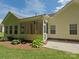 Spacious backyard featuring a screened in porch, lush green grass, and a patio area at 509 Settlers Grove Ln, Salisbury, NC 28146