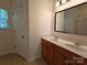 Well-lit bathroom with a double sink vanity, enhancing convenience for daily routines at 509 Settlers Grove Ln, Salisbury, NC 28146