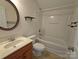 Functional bathroom includes a vanity with sink, toilet, and tub-shower with built-in shelving at 509 Settlers Grove Ln, Salisbury, NC 28146