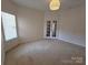 Spacious bedroom with neutral carpet, large window, and double French doors at 509 Settlers Grove Ln, Salisbury, NC 28146