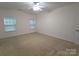 Clean and bright bedroom with carpet, neutral paint, and a ceiling fan at 509 Settlers Grove Ln, Salisbury, NC 28146