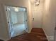 Inviting foyer with hardwood floors leading to a room with French doors and carpet at 509 Settlers Grove Ln, Salisbury, NC 28146